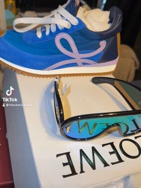 Loewe Blue and Pink Women’s Runner Sneaker with Navy Accents and sunglasses